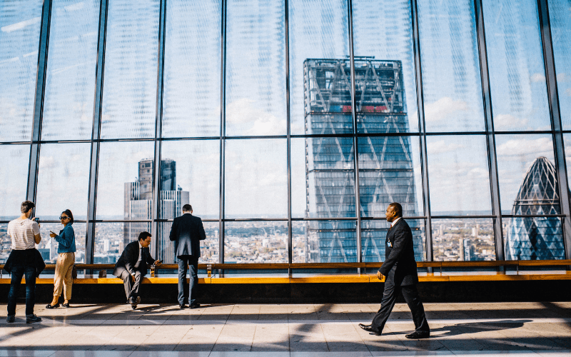 A man walking in large company building 