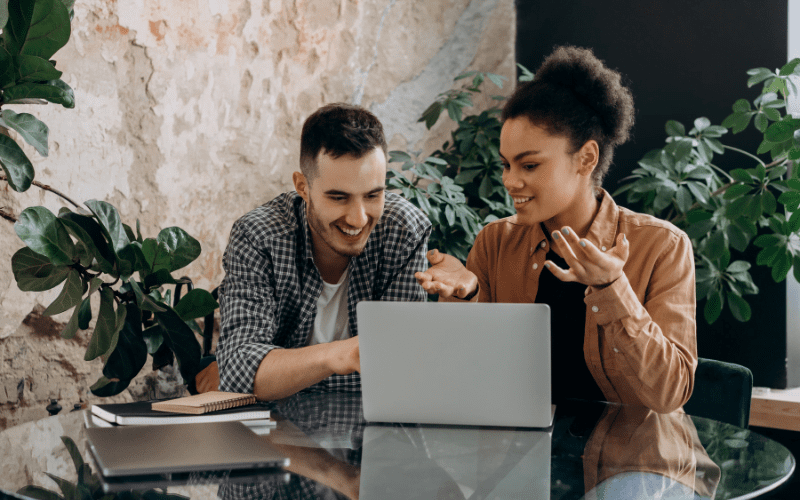 A man and a lady sitting together with a laptop and exploring the high paying engineering jobs or engineering jobs with high salaries in Australia